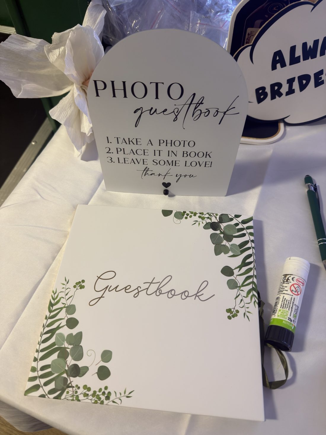 Photo guestbook sign and book set up at an event